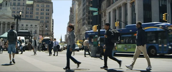 People walk on a busy New York street in Highest 2 Lowest.