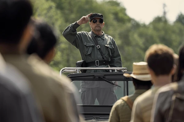 A soldier salutes from a vehicle in The Long Walk.