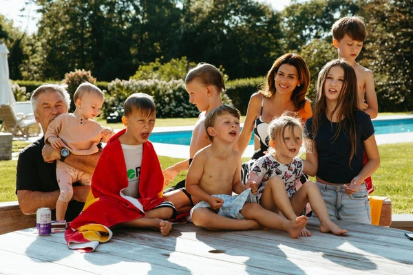 The Baldwin family gathers by the pool in The Baldwins.